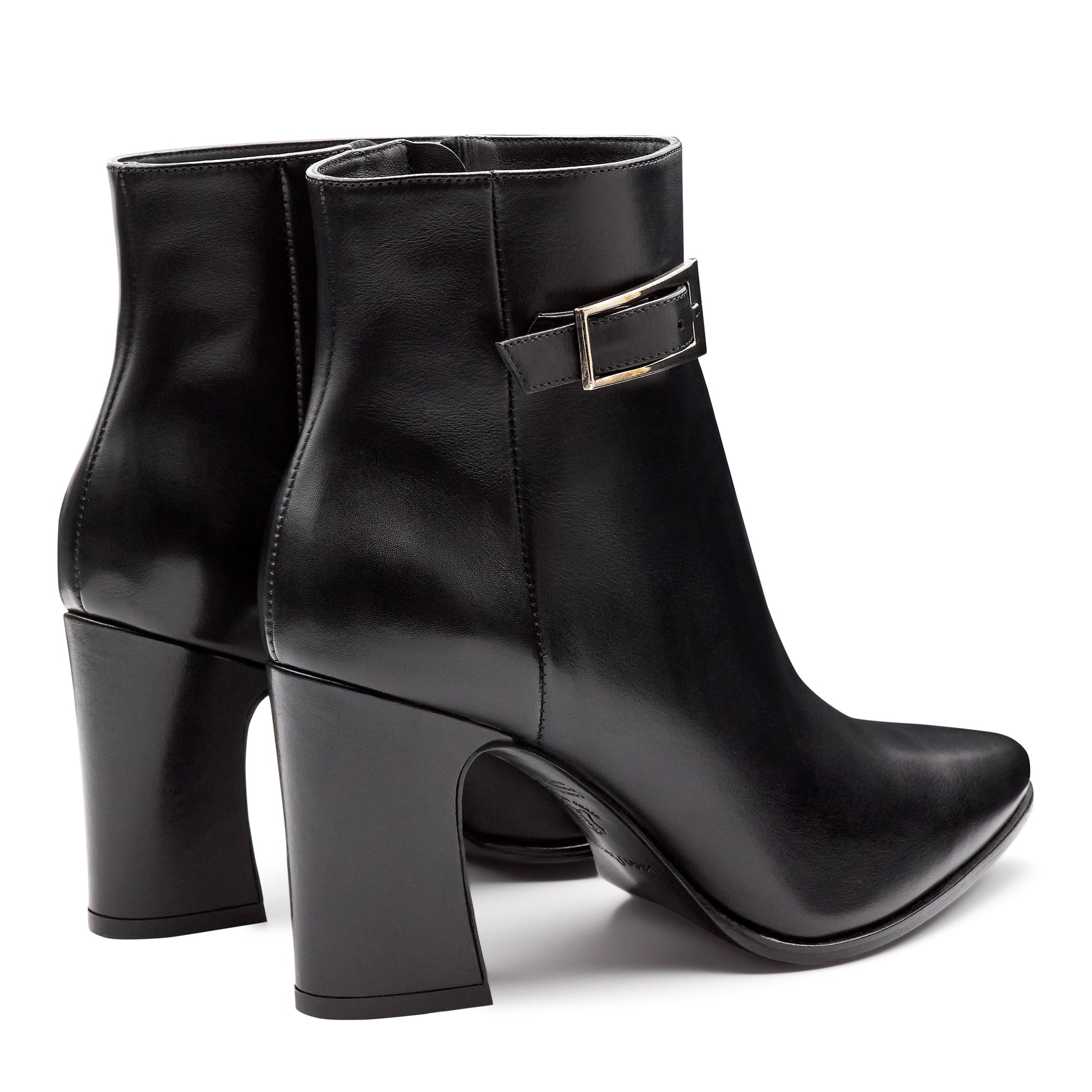 Botines negros de piel con hebilla lateral y tacón alto para dama